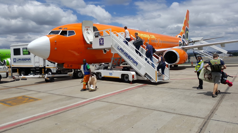 Passengers boarding Mango airliner